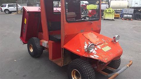 I mounted a Wheel Horse Plow lever used to angle the plow to activate the dump. . Heald hauler